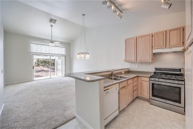 kitchen featuring white dishwasher, under cabinet range hood, stainless steel range with gas cooktop, and light brown cabinetry