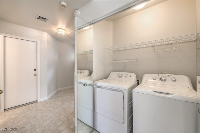 washroom featuring laundry area, washer and clothes dryer, and visible vents