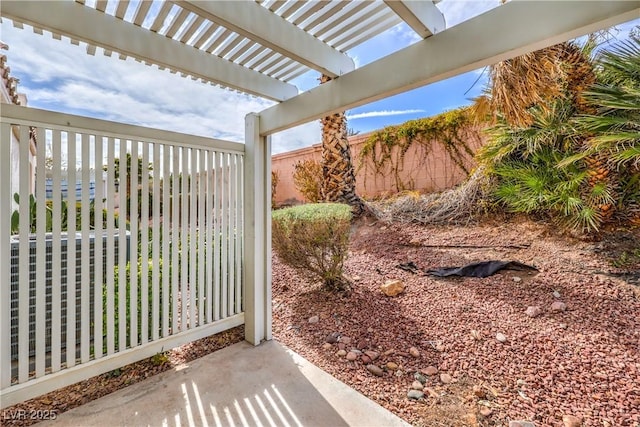 view of yard with fence and a pergola