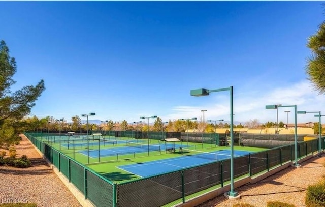 view of tennis court with fence