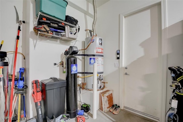 utility room featuring water heater