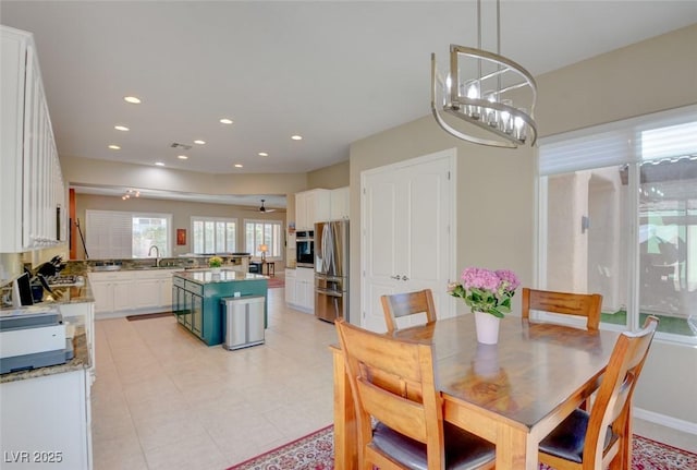 dining space featuring a chandelier and recessed lighting