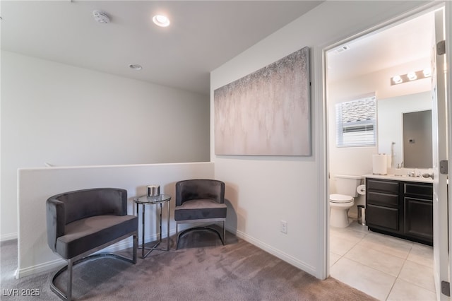 living area featuring light tile patterned floors