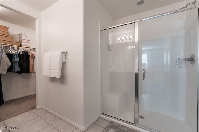 bathroom with tile patterned flooring and an enclosed shower