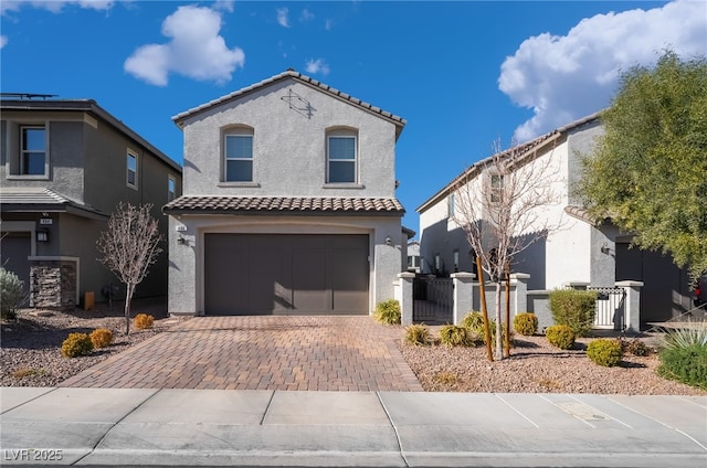 mediterranean / spanish-style home with a garage