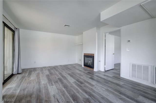 unfurnished living room with hardwood / wood-style flooring