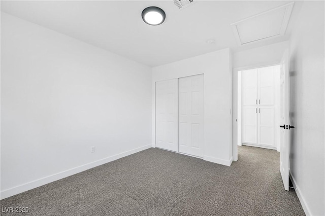 unfurnished bedroom with a closet and carpet flooring