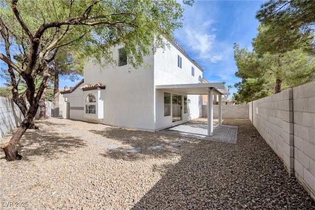 back of property featuring a patio area