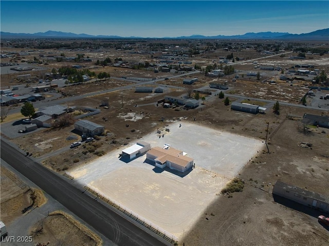 drone / aerial view featuring a mountain view