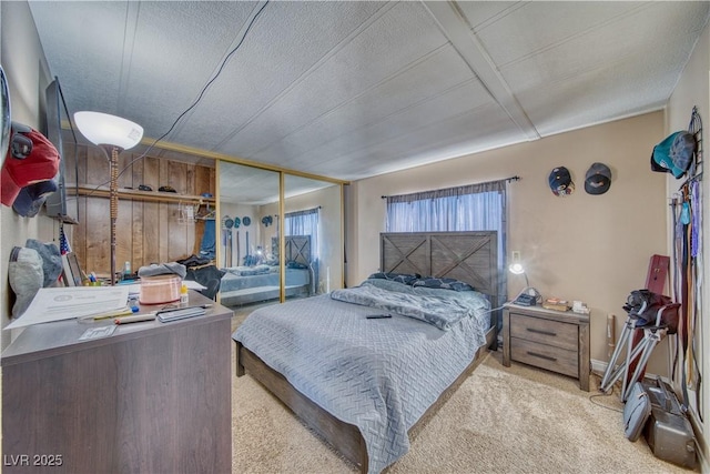 bedroom with light colored carpet