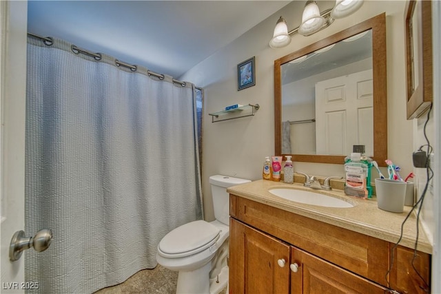 bathroom featuring toilet, curtained shower, and vanity