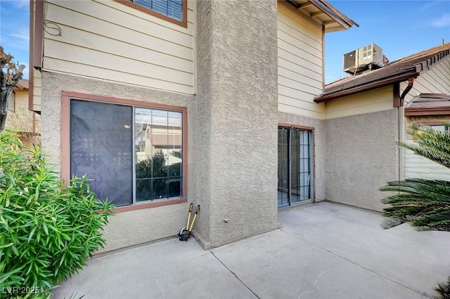 exterior space featuring central AC unit and a patio area