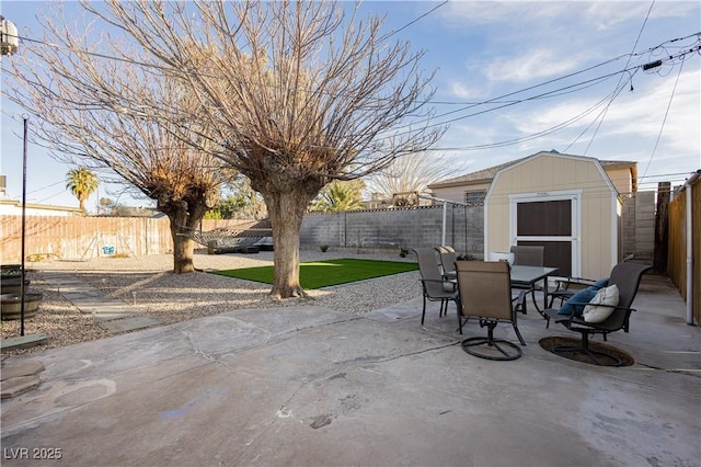 view of patio / terrace featuring a storage unit