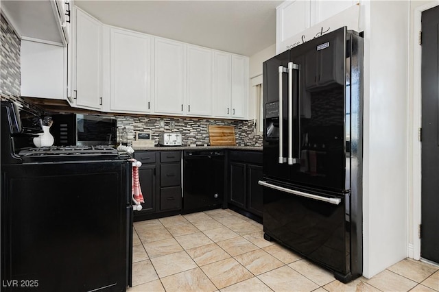 kitchen featuring white cabinetry, black appliances, tasteful backsplash, and light tile patterned floors