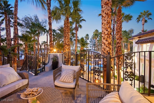 view of balcony at dusk