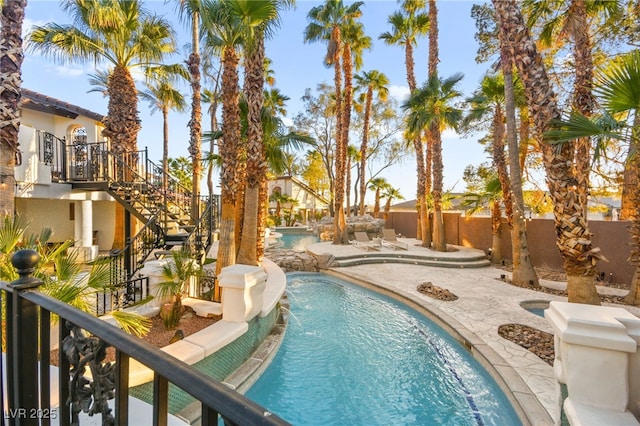 view of pool with pool water feature