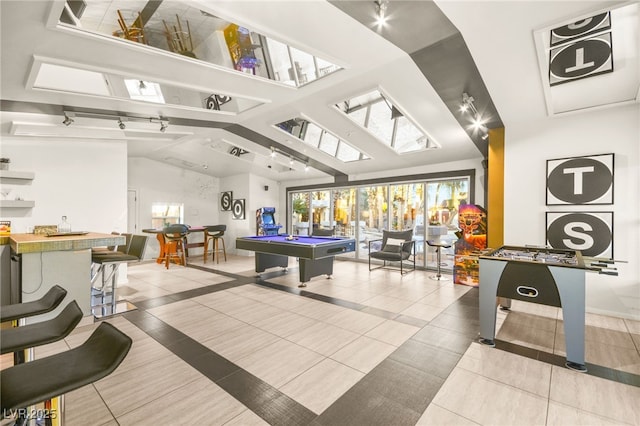 game room with lofted ceiling with beams, billiards, and tile patterned flooring