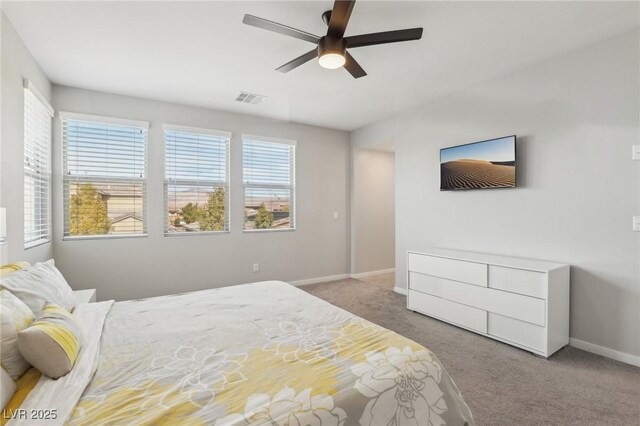 9690 Hiking Ave, Las Vegas, NV 89166 - carpeted bedroom with a ceiling fan, visible vents, and baseboards