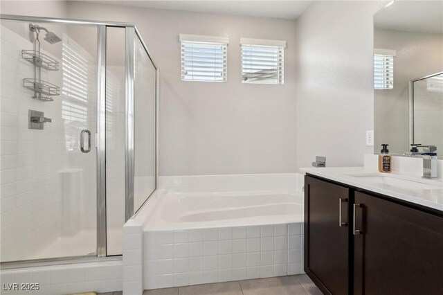 9690 Hiking Ave, Las Vegas, NV 89166 - full bathroom featuring a stall shower, a garden tub, vanity, and tile patterned floors