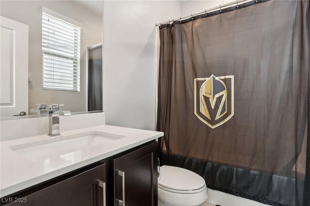 9690 Hiking Ave, Las Vegas, NV 89166 - full bathroom with vanity, toilet, and shower / bath combo with shower curtain