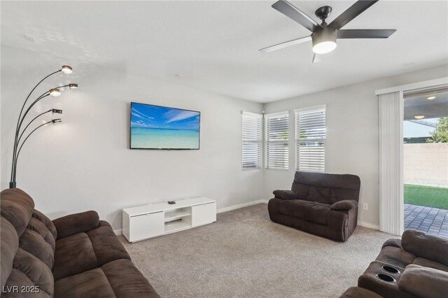 9690 Hiking Ave, Las Vegas, NV 89166 - living room with ceiling fan, baseboards, and light colored carpet