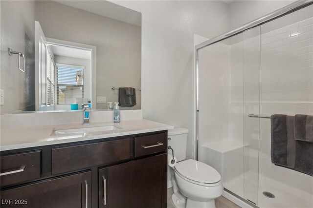 9690 Hiking Ave, Las Vegas, NV 89166 - full bathroom featuring toilet, a stall shower, and vanity