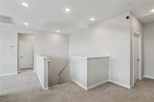 9690 Hiking Ave, Las Vegas, NV 89166 - hallway featuring recessed lighting, light carpet, visible vents, baseboards, and an upstairs landing