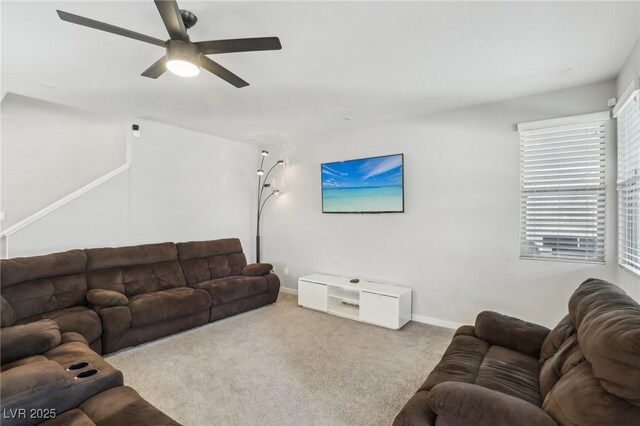 9690 Hiking Ave, Las Vegas, NV 89166 - living area with baseboards, a ceiling fan, and light colored carpet