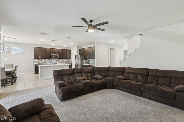 9690 Hiking Ave, Las Vegas, NV 89166 - living area with light tile patterned floors, visible vents, baseboards, ceiling fan with notable chandelier, and recessed lighting