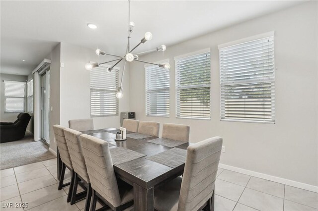 9690 Hiking Ave, Las Vegas, NV 89166 - dining room featuring light tile patterned floors, a notable chandelier, and baseboards