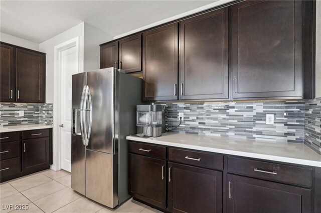 9690 Hiking Ave, Las Vegas, NV 89166 - kitchen featuring stainless steel fridge, light countertops, and dark brown cabinets