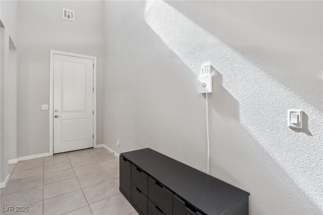 9690 Hiking Ave, Las Vegas, NV 89166 - entryway with visible vents, baseboards, and light tile patterned floors