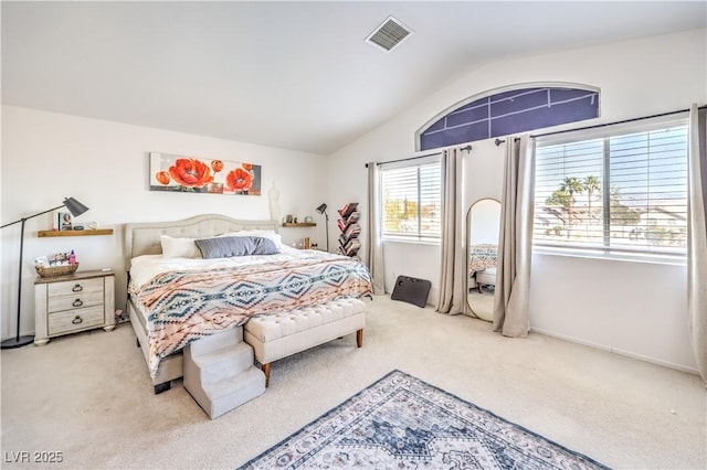 carpeted bedroom with vaulted ceiling