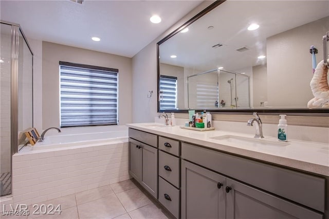 bathroom featuring shower with separate bathtub, tile patterned floors, and vanity