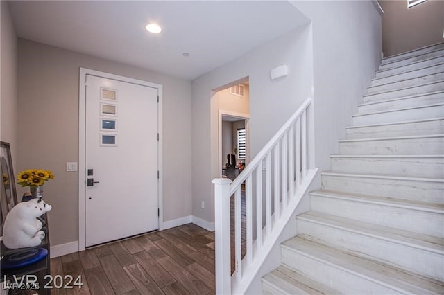 entrance foyer with dark hardwood / wood-style floors