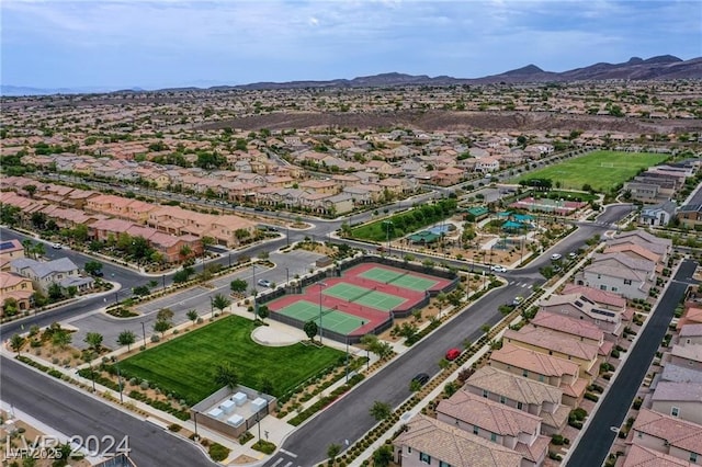 birds eye view of property with a mountain view