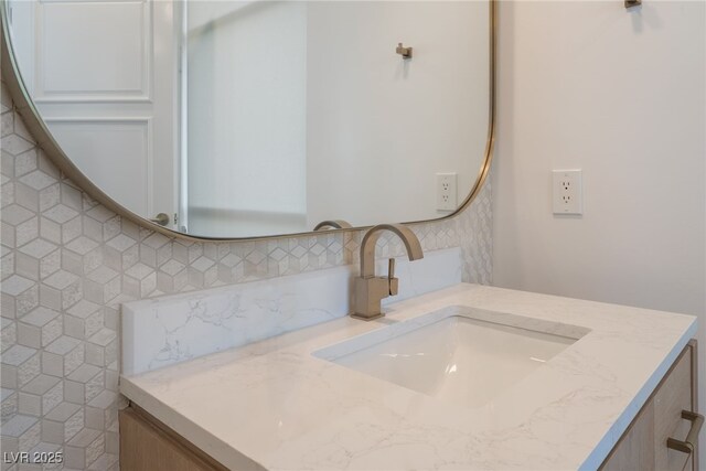 bathroom featuring backsplash and vanity