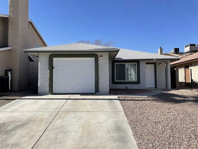 single story home with a garage