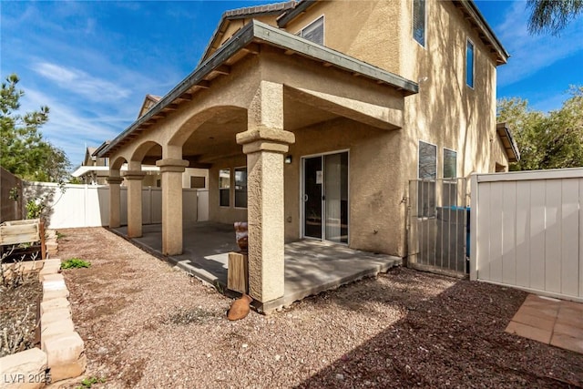 back of property featuring a patio