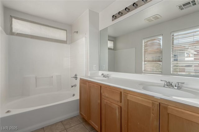 bathroom with tile patterned floors, shower / bath combination, and vanity