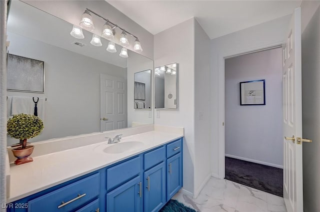 bathroom with visible vents, marble finish floor, vanity, and baseboards