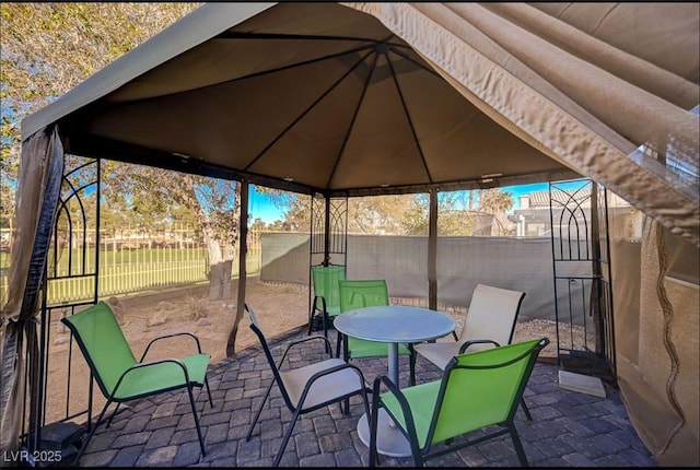 view of patio / terrace featuring fence and a gazebo