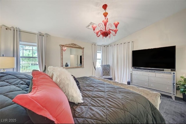 carpeted bedroom with vaulted ceiling, visible vents, and a notable chandelier