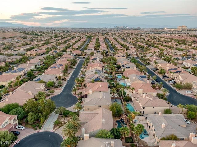 birds eye view of property with a residential view