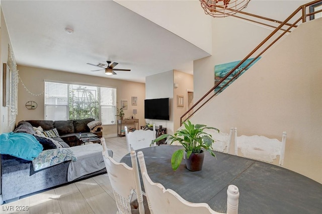 dining room with ceiling fan and light tile patterned floors