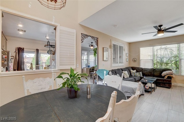 dining space with ceiling fan and a wealth of natural light