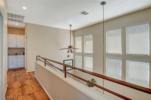 hall with light wood-type flooring