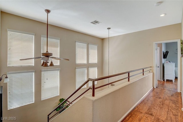 hallway with light hardwood / wood-style flooring