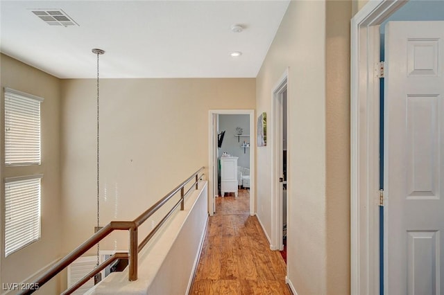 hall with light hardwood / wood-style floors