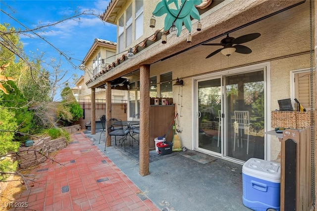 view of patio featuring ceiling fan